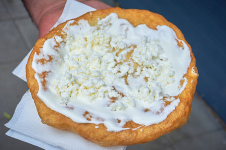 Langos with sour cream and cheese, a typical Hungarian food.の写真素材