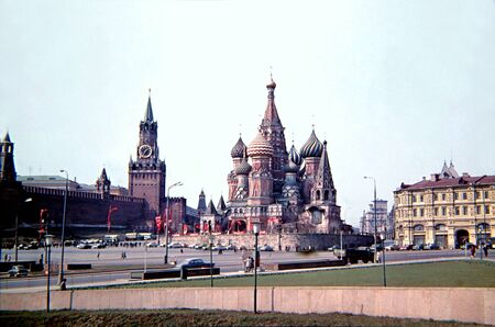 Moscow, Russia, Soviet Union - 1970: the red square, st. basil's cathedral and kremlin palace, during cold war, with traffic and vintage carsのeditorial素材