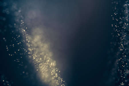 Glitter lights abstract background. Defocused bokeh dark illustration