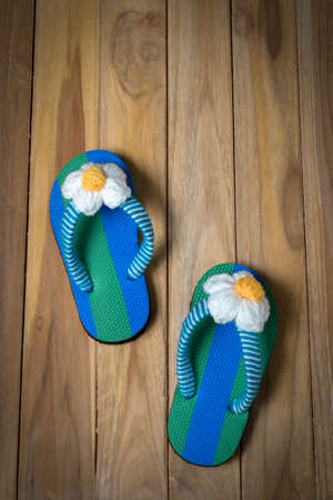 colorfull sandal with flower on wooden backgroundの写真素材