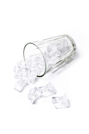 Glass with ice on white background
