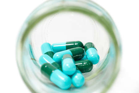 Close up shot of pills isolated on white background.の写真素材