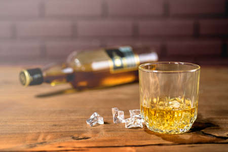 Whiskey drinks on wood in bar