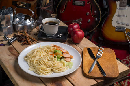 spaghetti with black pepper sauce on wood tableの写真素材