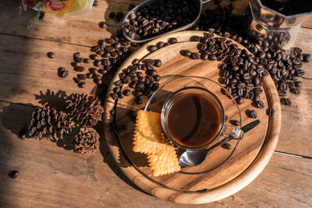 still life fresh coffee set on wood table with morning lightの写真素材