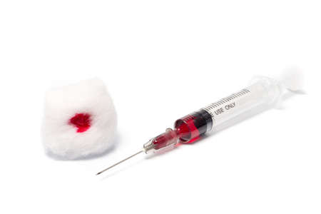 syringe with blood isolated on whiteの写真素材