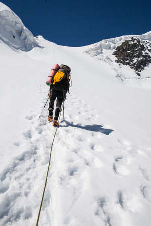 Altai, Russia - July 11, 2014: Climbers at the mountain summit in on the way to the top of Beluhaのeditorial素材