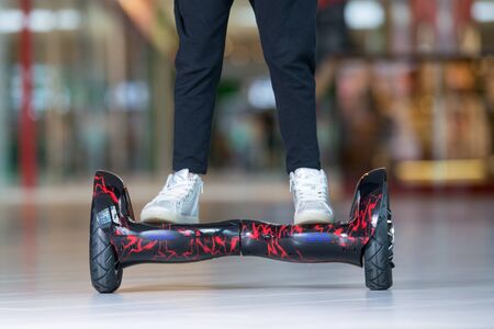 Girl feet on the hover board. Self-balancing scooter or mini segwayの写真素材