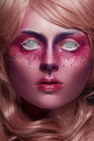 Beautiful girl with art creative make-up. Beauty is an art faceの写真素材