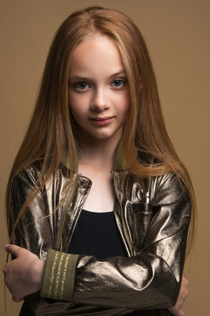 Close-up portrait of beautiful young redhead in studio on black backgroundの写真素材