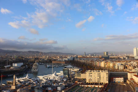 View of the evening Barcelona and the bay with yachts from the cable car, Catalonia, Spain, aerial...