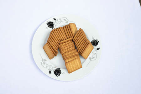 Top View Brown-wheat Biscuits in the Plate isolated Background.