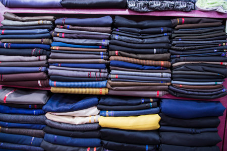 Patterned Textile Fabrics  stacked on a retail Shop Shelf for saleの写真素材