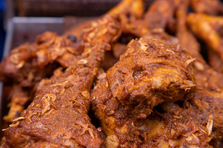 Roasted leg pieces of mutton at a street food market in Dhaka, Bangladeshの写真素材