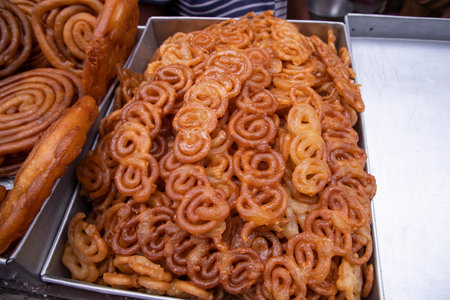 Delicious Testy sweet fried jalebi showing for sale on a street food market in the Chakbazar, Dhaka-Bangladeshの写真素材