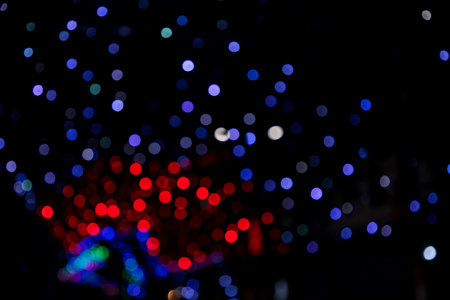 Colorful Defocus Abstract bokeh light effects on the street night black background texture wallpaper