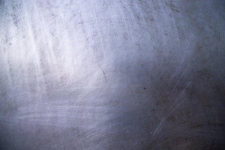 Scratched industrial Metalplate surface can be used as a background and textureの写真素材
