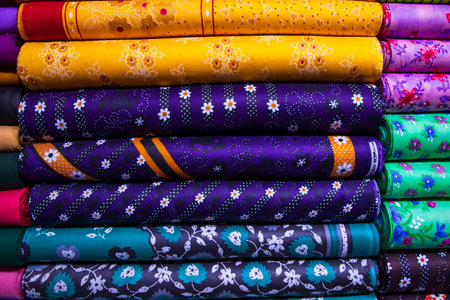 Artistic variety shade tone textile printed colors Fabrics stacked on retail Shop Shelf to saleの写真素材