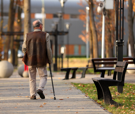older man on a walk in the parkの写真素材