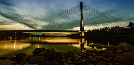 The bridge at sunset on the Vistula River in Polandの写真素材