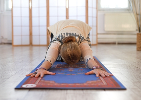 woman practicing yoga in a beautiful spaceの写真素材