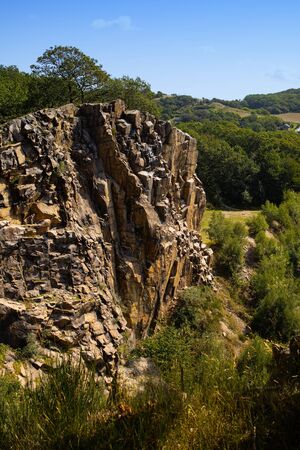 View of mountains. Lake surrounded by rocks on the island of Bornholm in Denmark.