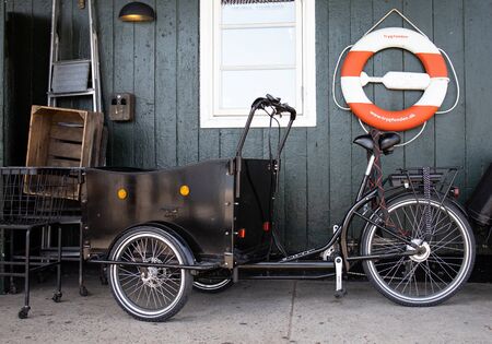 rickshaw bike parked in front of the house, Svaneke, Bornholm