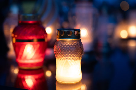 Candle light in a cemetery at night. Selective focus.の写真素材