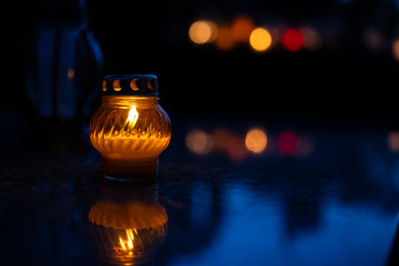 Candle light in the dark with blurred bokeh background.