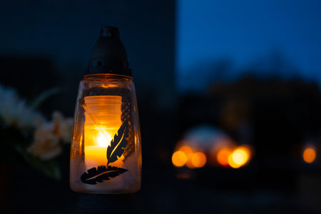 Lantern on the background of burning candles in the night.の写真素材