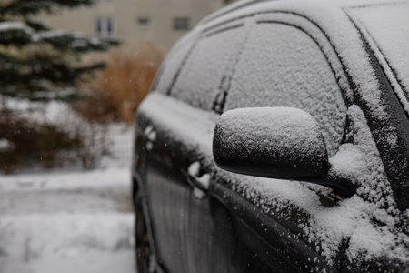 Car covered with snow in the winter. Snow on the car.の写真素材