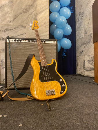 Electric guitar and amplifier on the background of the wall with balloons.の写真素材