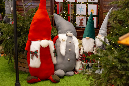 Christmas decoration in the form of gnomes on the background of a Christmas treeの写真素材