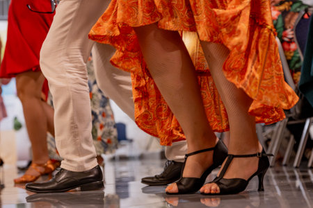 Details of the legs and shoes of a young caucasian couple dancingの写真素材