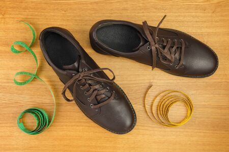 Footwear Still Life. Composition with wooden shoes and shoes.の写真素材