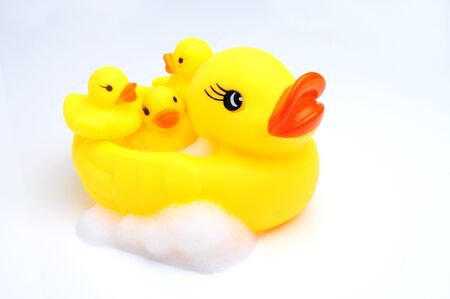Yellow duck with babies in bathroomの写真素材