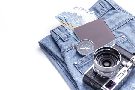 vintage camera. compass, passport, money and jeans prepared for travel, image with copy space