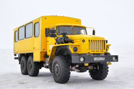 NOVYY URENGOY, RUSSIA - MARCH 10, 2013  Yellow URAL 3255 cross-country bus at the snow field のeditorial素材