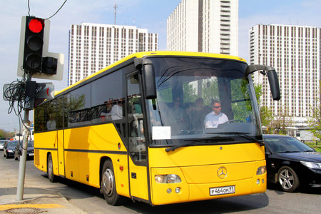 MOSCOW, RUSSIA - MAY 5, 2012  Yellow Mercedes-Benz O560 intouro interurban bus at the city street のeditorial素材