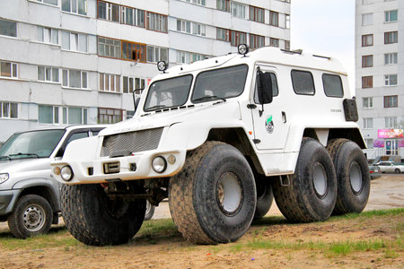 NOVYY URENGOY, RUSSIA - JUNE 20, 2013  White Trecol 39294 cross-country vehicle at the city street のeditorial素材