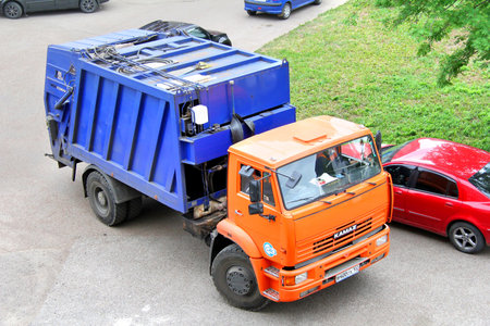 UFA, RUSSIA - MAY 28, 2012  Orange KAMAZ 53605 garbage truck at the city street のeditorial素材
