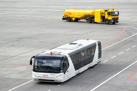 MOSCOW, RUSSIA - SEPTEMBER 9, 2013: White Neoplan N9122 airport bus at the Vnukovo international airport.のeditorial素材