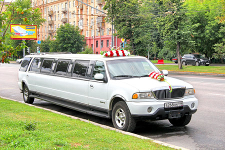 MOSCOW, RUSSIA - JULY 7, 2012: White Lincoln Navigator wedding limousine at the city street.のeditorial素材