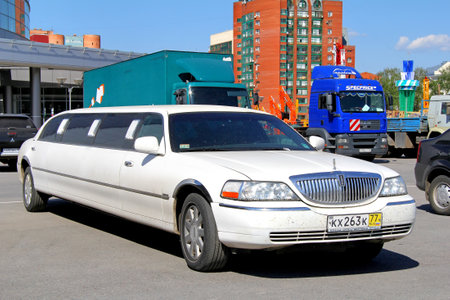 UFA, RUSSIA - MAY 22, 2012: White limousine Lincoln Town Car at the city street.のeditorial素材