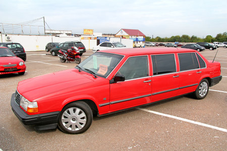 UFA, RUSSIA - APRIL 19, 2012: Red limousine Volvo 940 in the used cars trade center.のeditorial素材