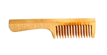 Wooden comb isolated over white background