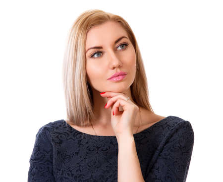 Thinking young woman isolated over white backgroundの写真素材