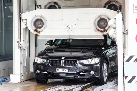 MONTREUX, SWITZERLAND - AUGUST 6, 2014: Motor car BMW F30 3-series at the car wash service station.のeditorial素材