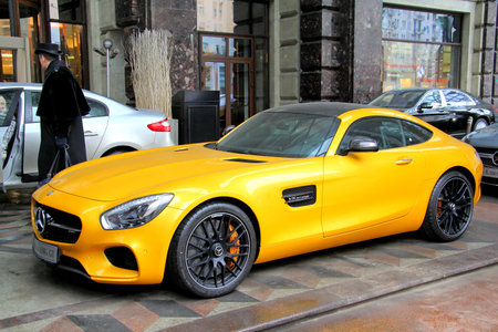 MOSCOW, RUSSIA - MARCH 8, 2015: Brand new yellow supercar Mercedes-AMG GT at the city street.のeditorial素材