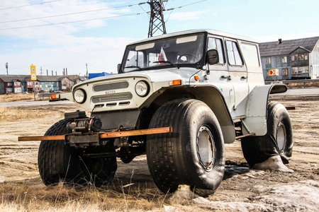 NOVYY URENGOY, RUSSIA - MAY 14, 2015: Grey cross-country vehicle Trecol 39041 at the city street.のeditorial素材